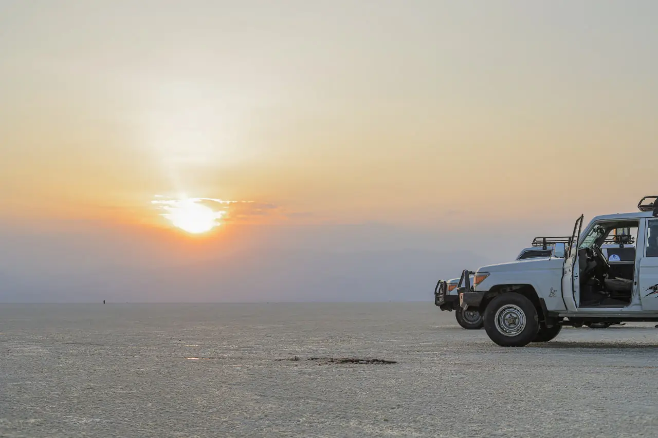 4x4 safari vehicles at sunset on an Ethiopia expedition